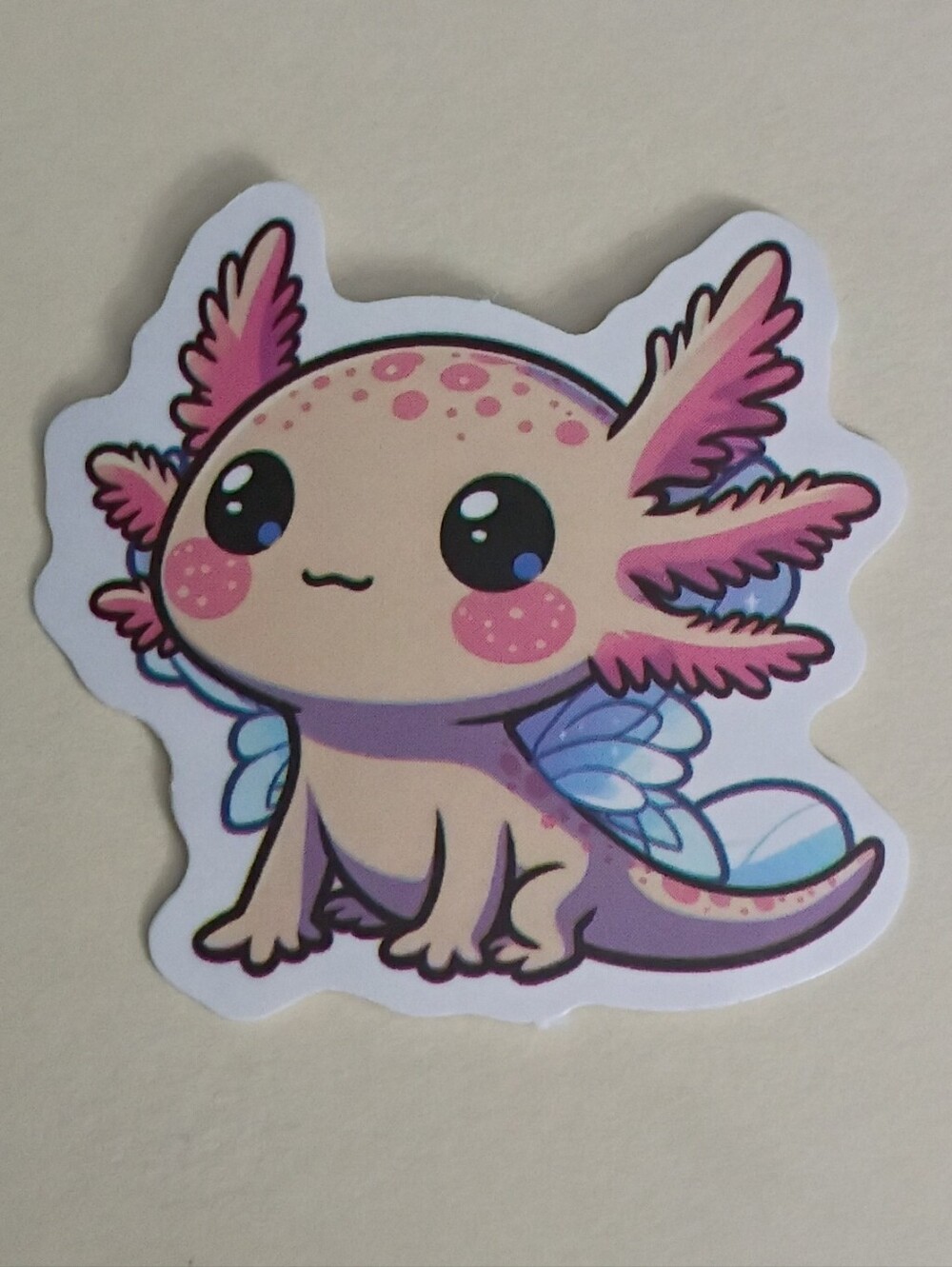 10/$10 Sticker - Axolotl Peachy Cream Color & Freckles With White & Blue Wings